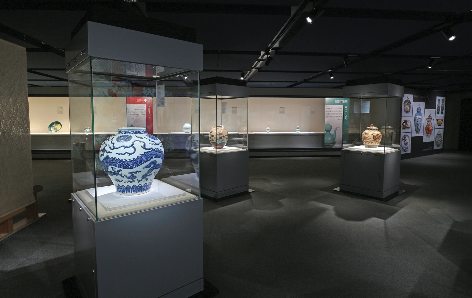 Museum gallery with artifacts displayed in illuminated cases